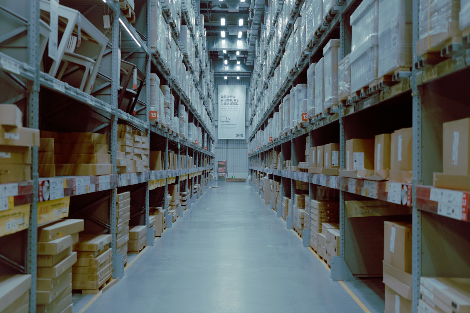 Long warehouse aisle lined with shelves
